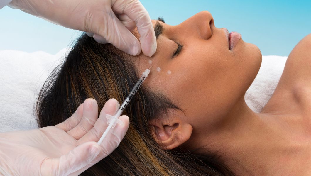 Woman receiving Botox injections for facial wrinkle reduction and non-surgical anti-aging treatment.
